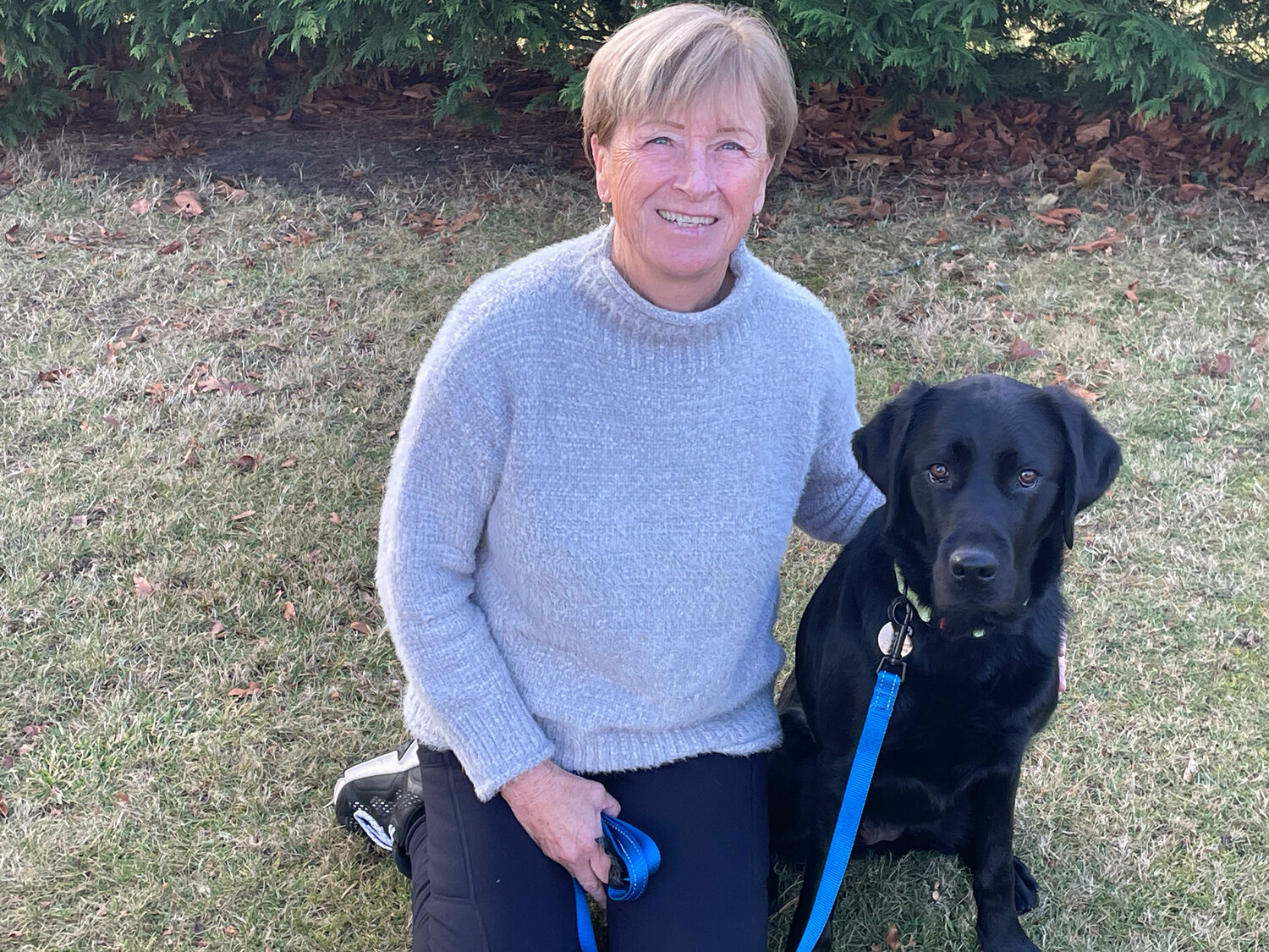 Ann Kaiser is pictured with Popcorn, her current foster canine companion dog. 